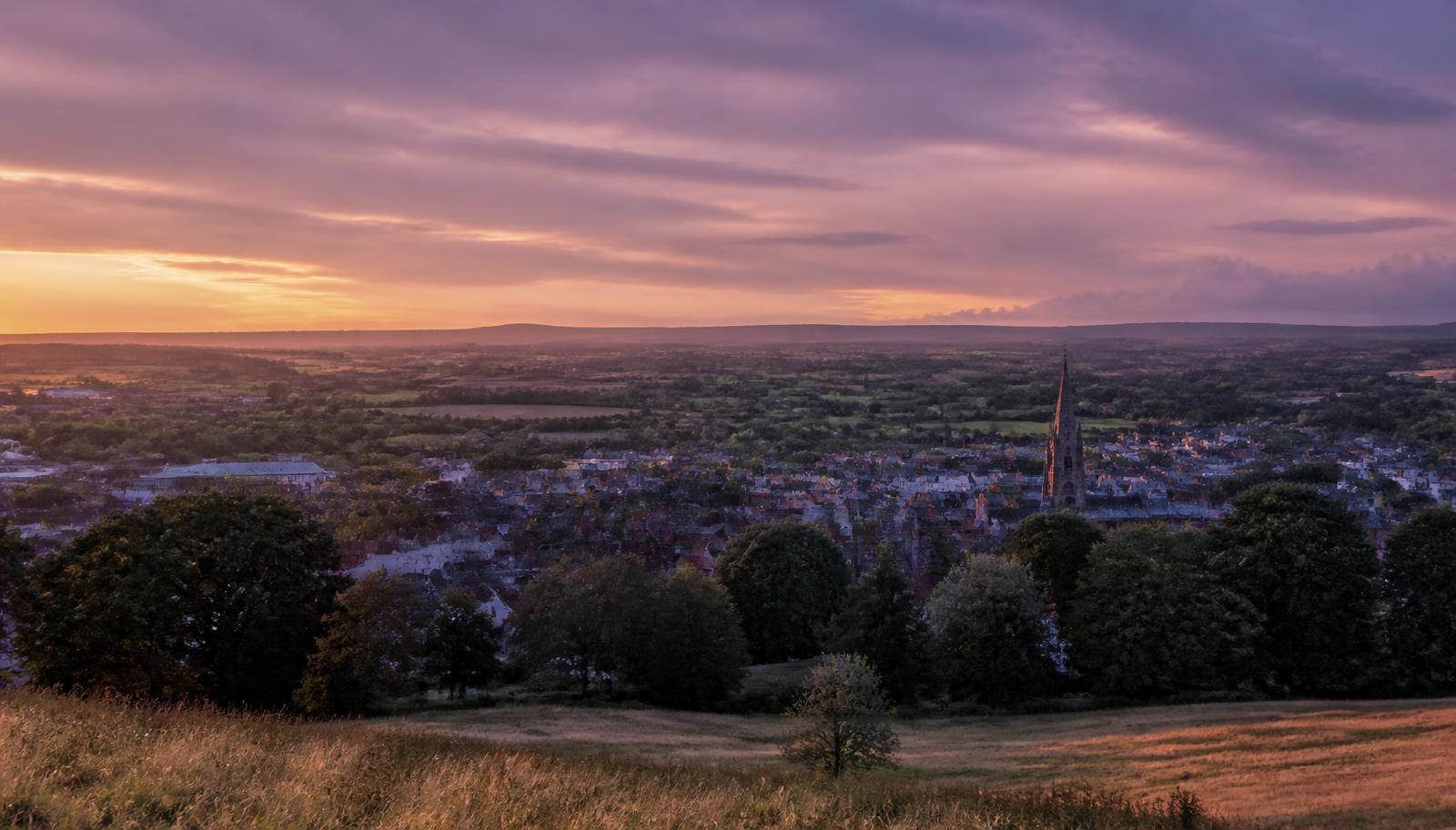 Cheshire countryside and town rooftops at sunset